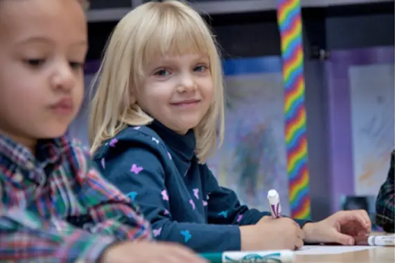 Childhood-Dev-3 Blond toddler girl coloring with markers